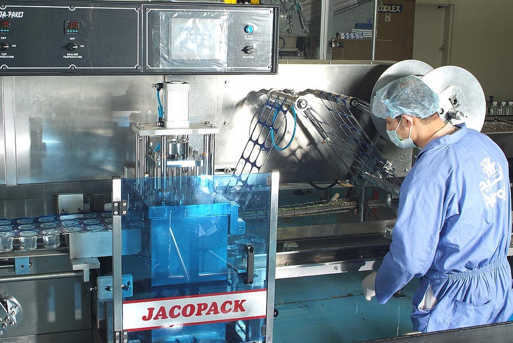 Abraaj technician at the packaging line